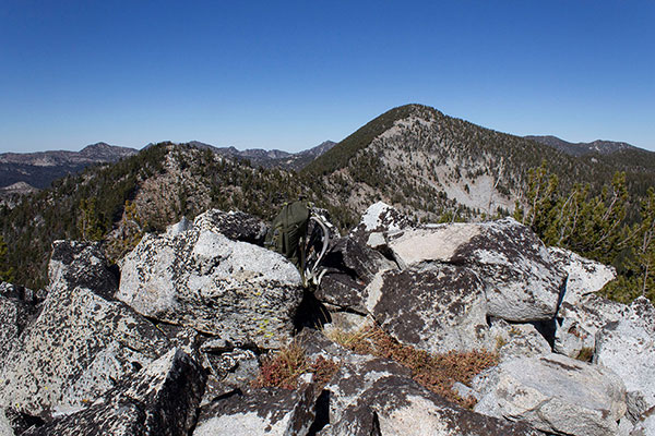 The summit of Chloride Ridge West Peak with Red Mountain beyond