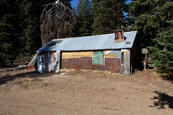 A boarded up cabin, likely someone's hunting lodge